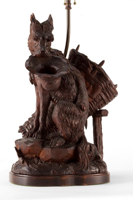 A BLACK FOREST CARVED WOOD LAMP WITH SHADE 20th: A BLACK FOREST CARVED WOOD LAMP WITH SHADE 20th century 31 inches high (78.7 cm)