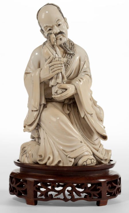 A CHINESE CARVED IVORY FIGURE Circa 1900 Marks:: A CHINESE CARVED IVORY FIGURE Circa 1900 Marks: (signed) 7-1/2 inches high (19.