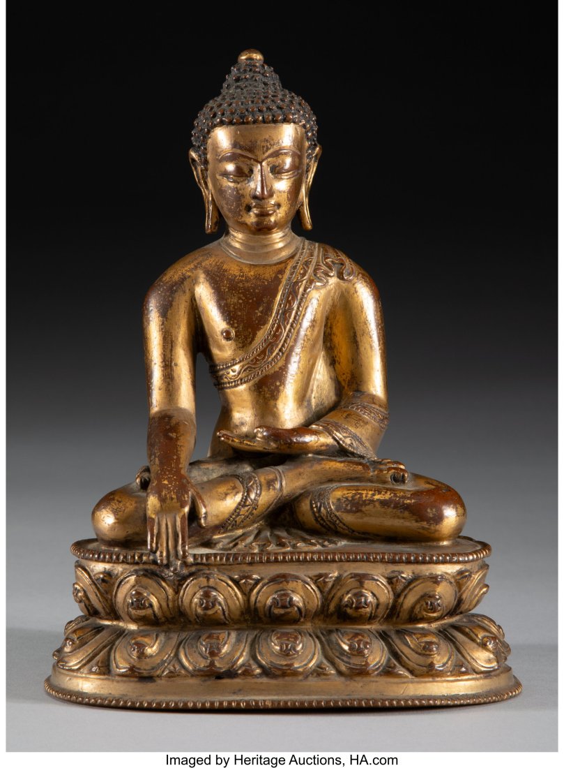 A Tibetan Gilt Bronze Seated Sakyamuni Figure, 1: A Tibetan Gilt Bronze Seated Sakyamuni Figure, 15th/ 16th century 6-1/2 x 4-7/8 x 3-1/4 inches (16.5 x 12.4 x 8.3 cm) PROVENANCE: From a New 