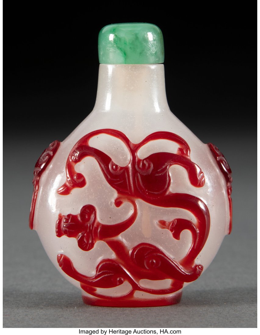 A Chinese Red Overlay Peking Glass Snuff Bottle : A Chinese Red Overlay Peking Glass Snuff Bottle 2-1/2 x 1-3/4 x 1 inches (6.4 x 4.4 x 2.5 cm) HID03101062020 © 2024 Heritage Auctions | All Rights Rese