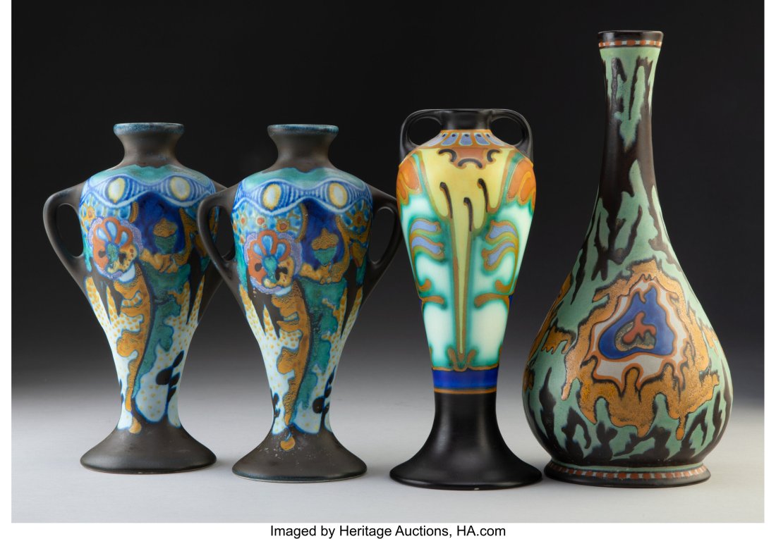 Four Dutch Earthenware Vases, circa 1920 Marks: Four Dutch Earthenware Vases, circa 1920 Marks: GOUDA, (underglaze little house mark), HOLLAND, (various) 11-1/2 inches (29.2 cm) (tallest) The collection comprising: 2 Corona pattern two-handled vase
