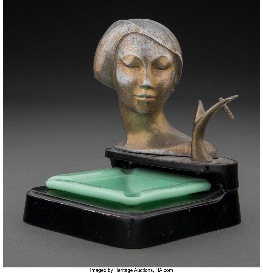 Frankart Enameled and Patinated Metal and Glass: Frankart Enameled and Patinated Metal and Glass Lady Smoker Figural Ashtray, circa 1925 Marks: FRANKART INC, PAT APPLD FOR 5-3/4 x 11 x 11-1/2 inches (14.5 x 27&p