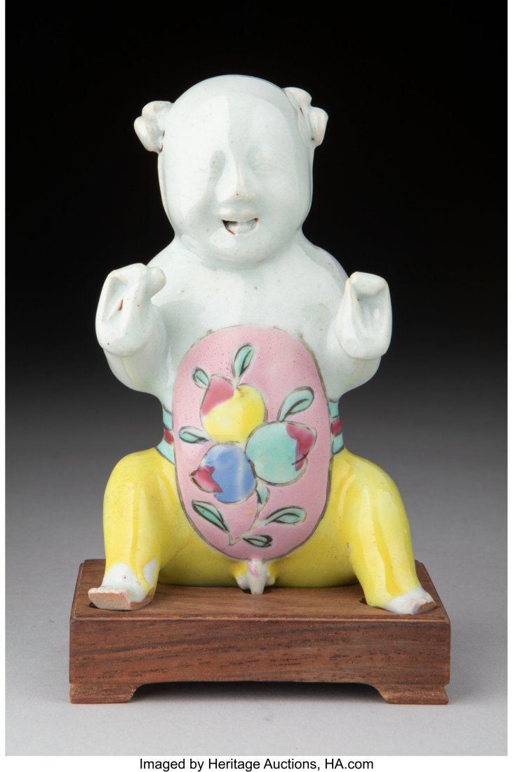 A Chinese Famille Rose Figure of a Seated Boy, L: A Chinese Famille Rose Figure of a Seated Boy, late Qing dynasty 4-1/4 x 2-5/8 x 1-3/4 inches (10.8 x 6.7 x 4.4 cm) HID03101062020 © 2024 Heritage Auctions | All Rights Reserved