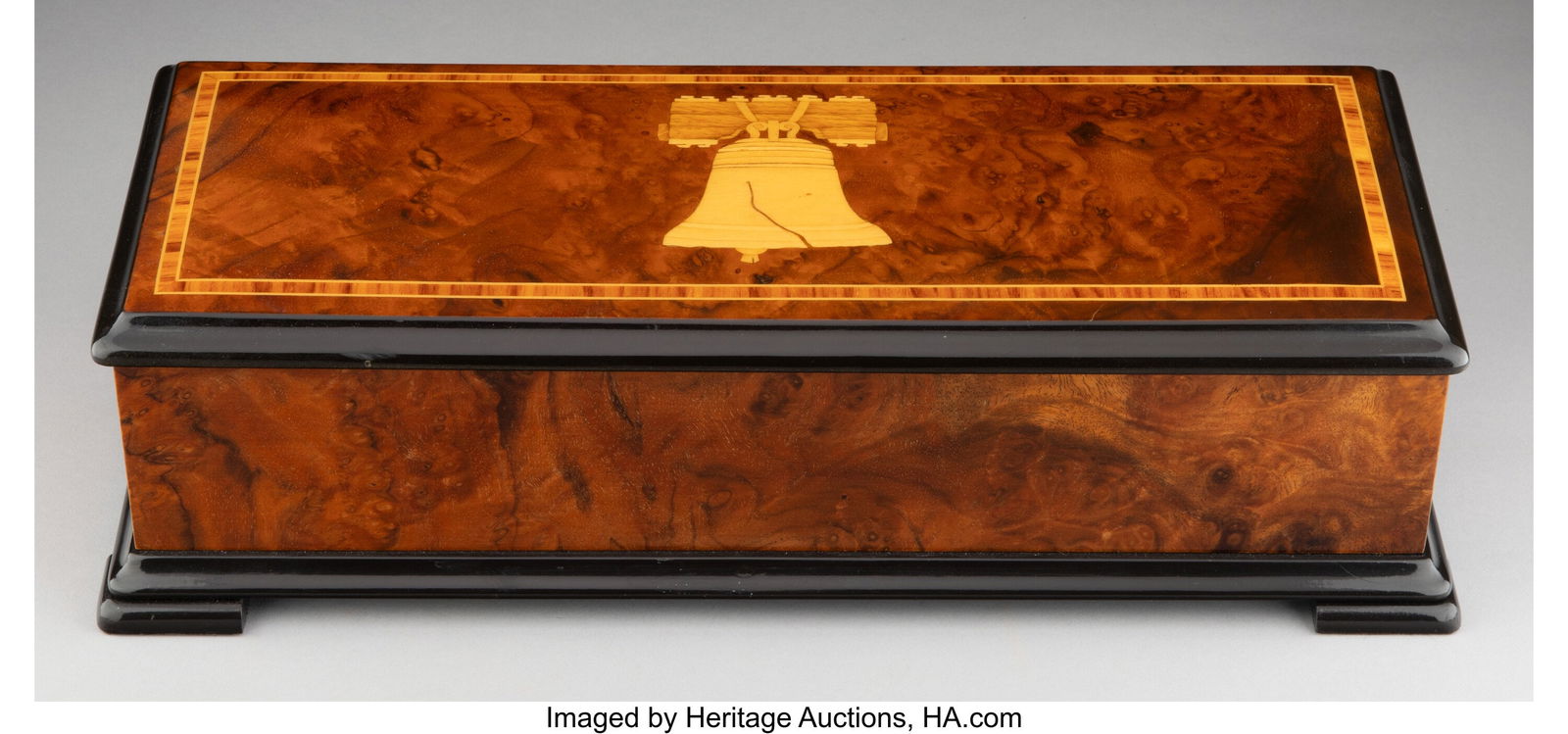 A Reuge Burl Walnut Chimes of Liberty Music Box,: A Reuge Burl Walnut Chimes of Liberty Music Box, circa 1975 Marks to movement: REUGE 77, SAINTE-CROIX, MADE IN SWITZERLAND, SWISS PATENT 3-3/4 x 14-1/2 x 6 inches