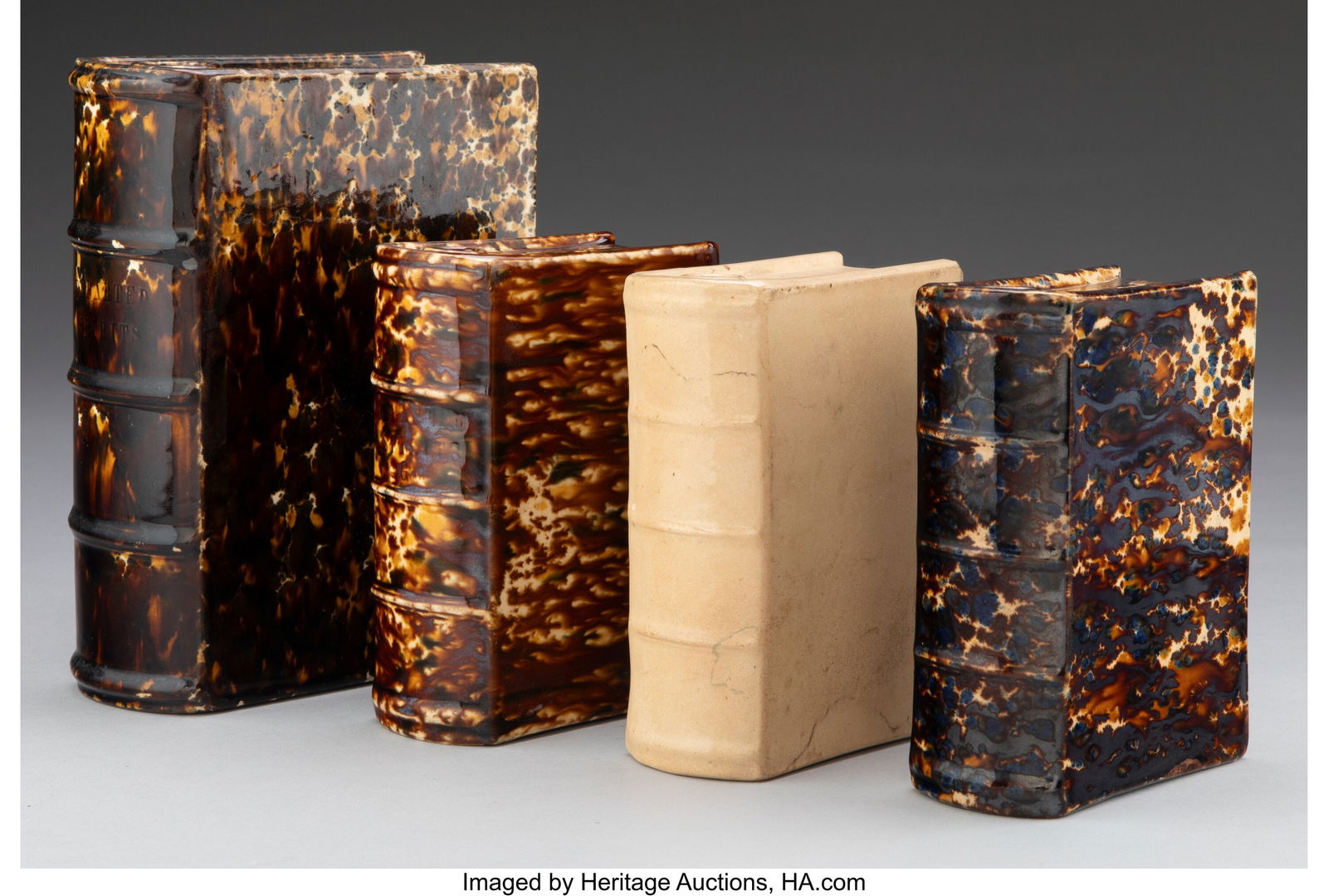 A Group of Four Glazed Earthenware Book-Form Fla: A Group of Four Glazed Earthenware Book-Form Flasks Attributed to Bennington, mid-19th century 7-3/4 x 5-5/8 x 2-5/8 inches (19.7 x 14.3 x 6.7 cm) &lpa