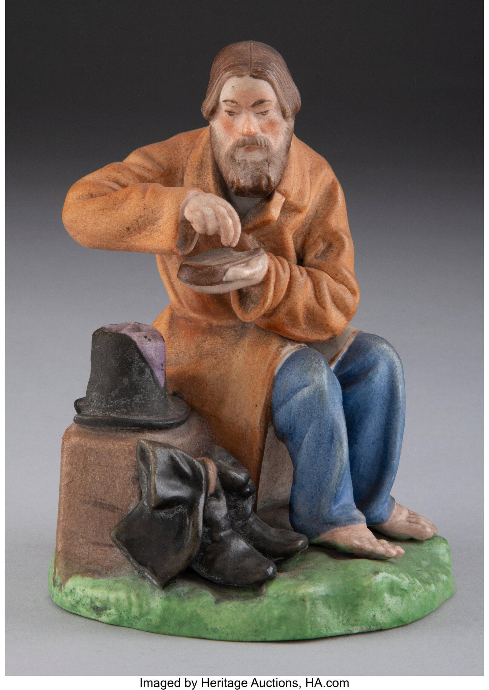 A Gardner Porcelain Factory Figure: A Man Saltin: A Gardner Porcelain Factory Figure: A Man Salting Bread, Verbilki, 19th century Marks: (red underglaze Gardner factory mark), (impressed factory mark), (impressed Cyrillic text), 7 5-1/2 x 3-1/2 x 3-1