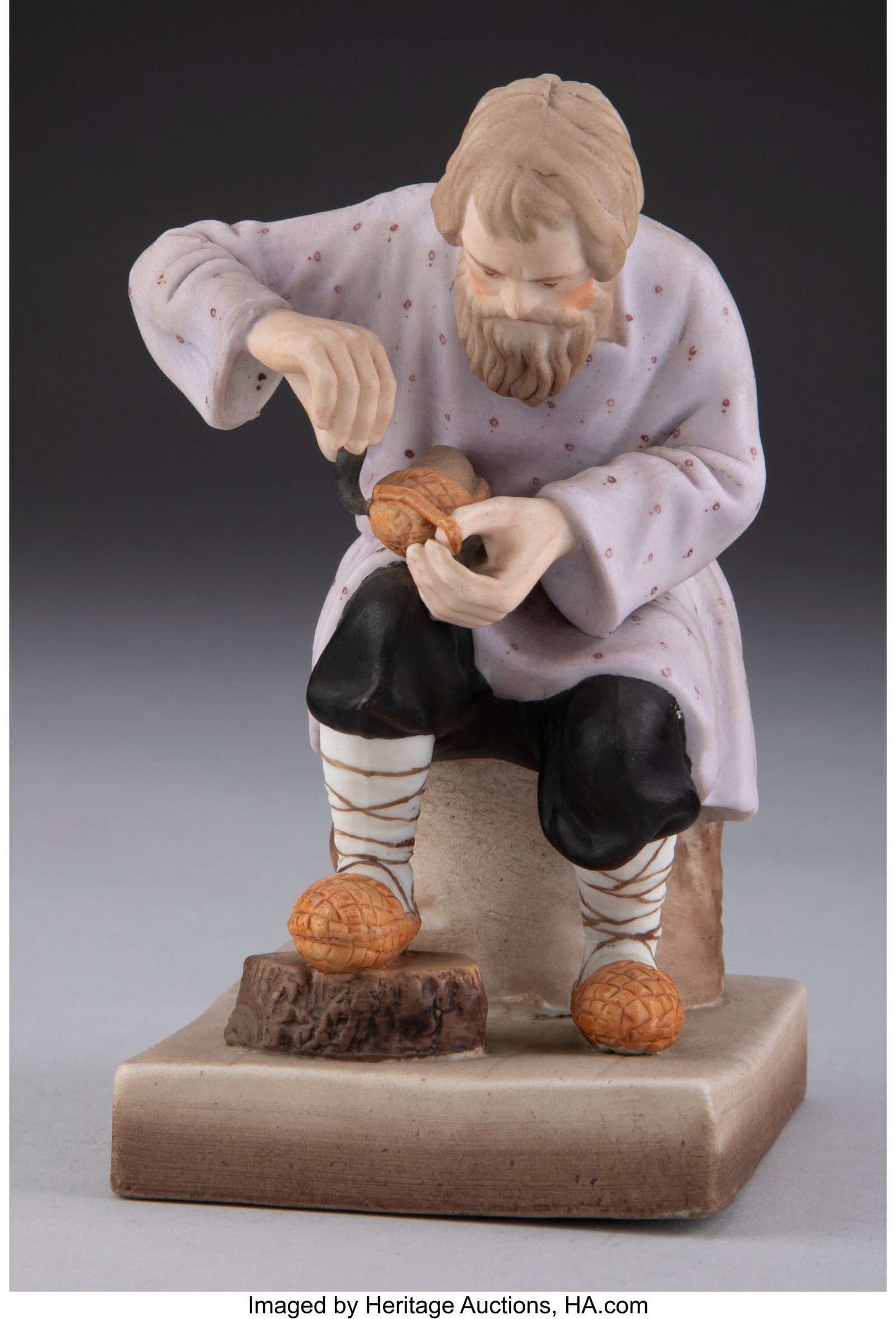 A Gardner Porcelain Factory Figure: A Bast Shoe: A Gardner Porcelain Factory Figure: A Bast Shoe Maker, Verbilki, late 19th century Marks: (impressed factory mark), (red factory mark) 5 x 2-3/4 x 3-3/8 inches (12.7 x 7.0 x 8.6 cm) Property from the 