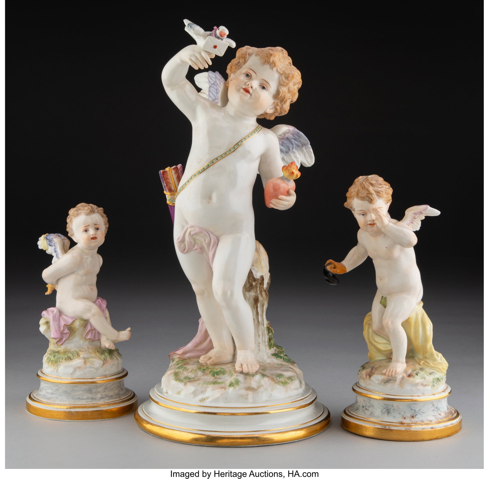 Three Meissen Partial Gilt Porcelain Cupid Figur: Three Meissen Partial Gilt Porcelain Cupid Figures, circa 1900 Marks: (crossed swords in blue underglaze), (various) 12-1/4 x 6 inches (31.1 x 15&