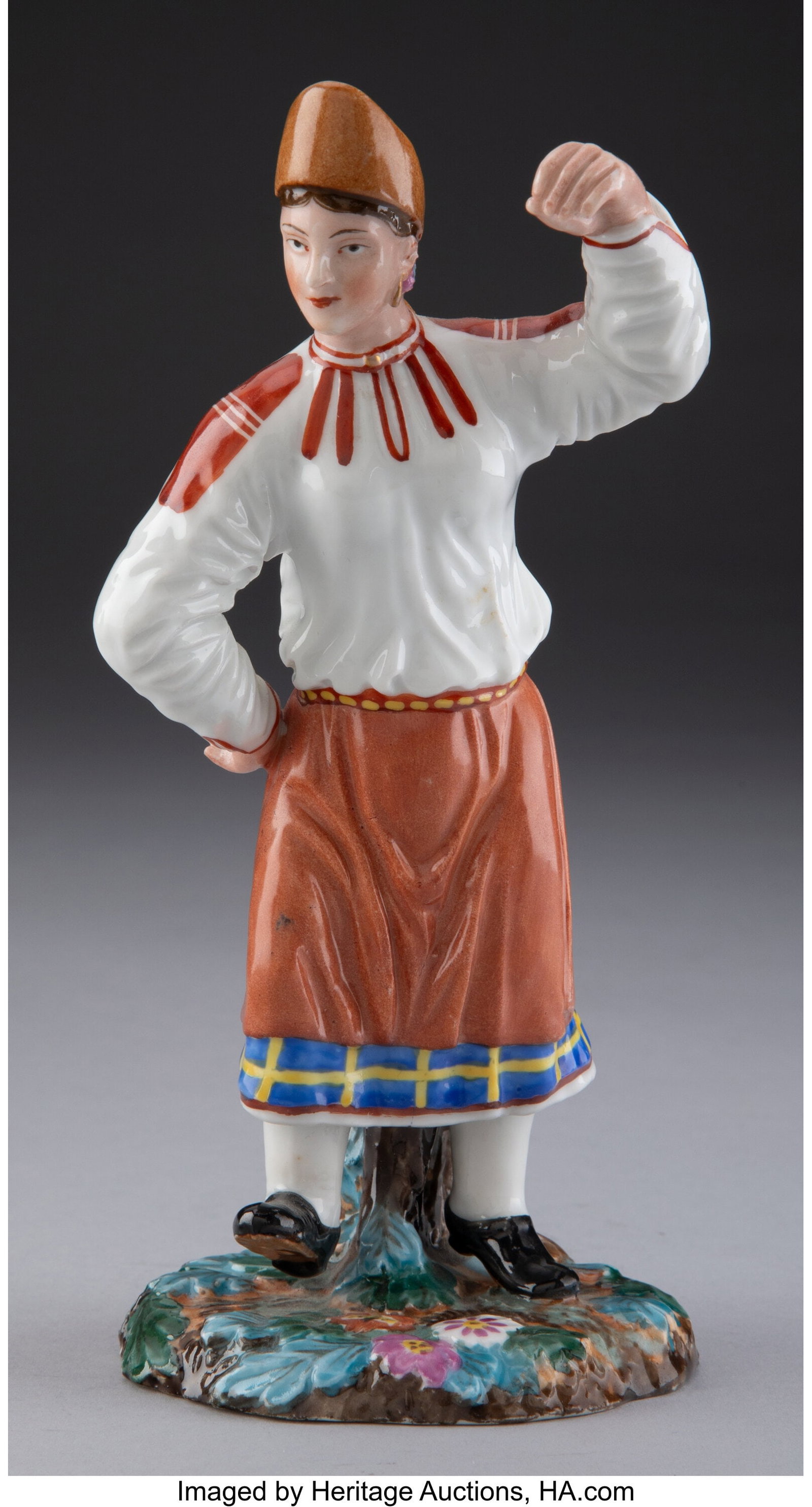 A Popov Porcelain Factory Figure: Dancing Peasan: A Popov Porcelain Factory Figure: Dancing Peasant Woman, Gorbunovo, 19th century Marks: (blue underglaze Popov factory mark) 7 x 3-1/2 x 2-3/4 inches (17