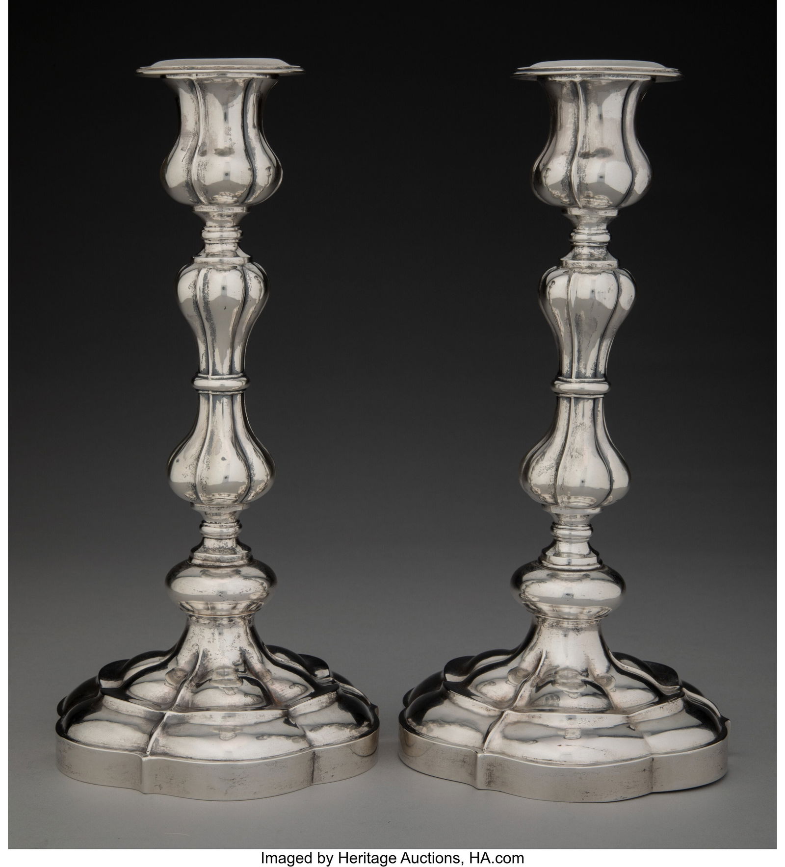 A Pair of Carl Gustav Ekqvist Silver Candlestick: A Pair of Carl Gustav Ekqvist Silver Candlesticks, St. Petersburg, 1866 Marks: 84, (town mark), (VS in cyrillic over 1866), CGE 10-1/