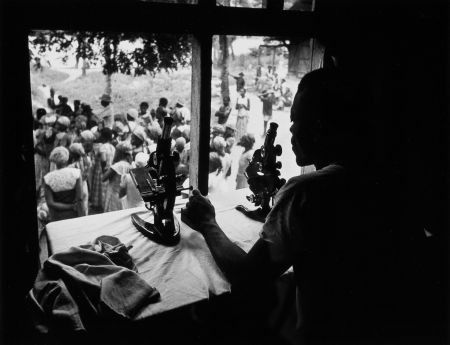 W. EUGENE SMITH (American, 1918-1978) Microscope: W. EUGENE SMITH (American, 1918-1978)Microscopes, The Leper Village, 1954Ge