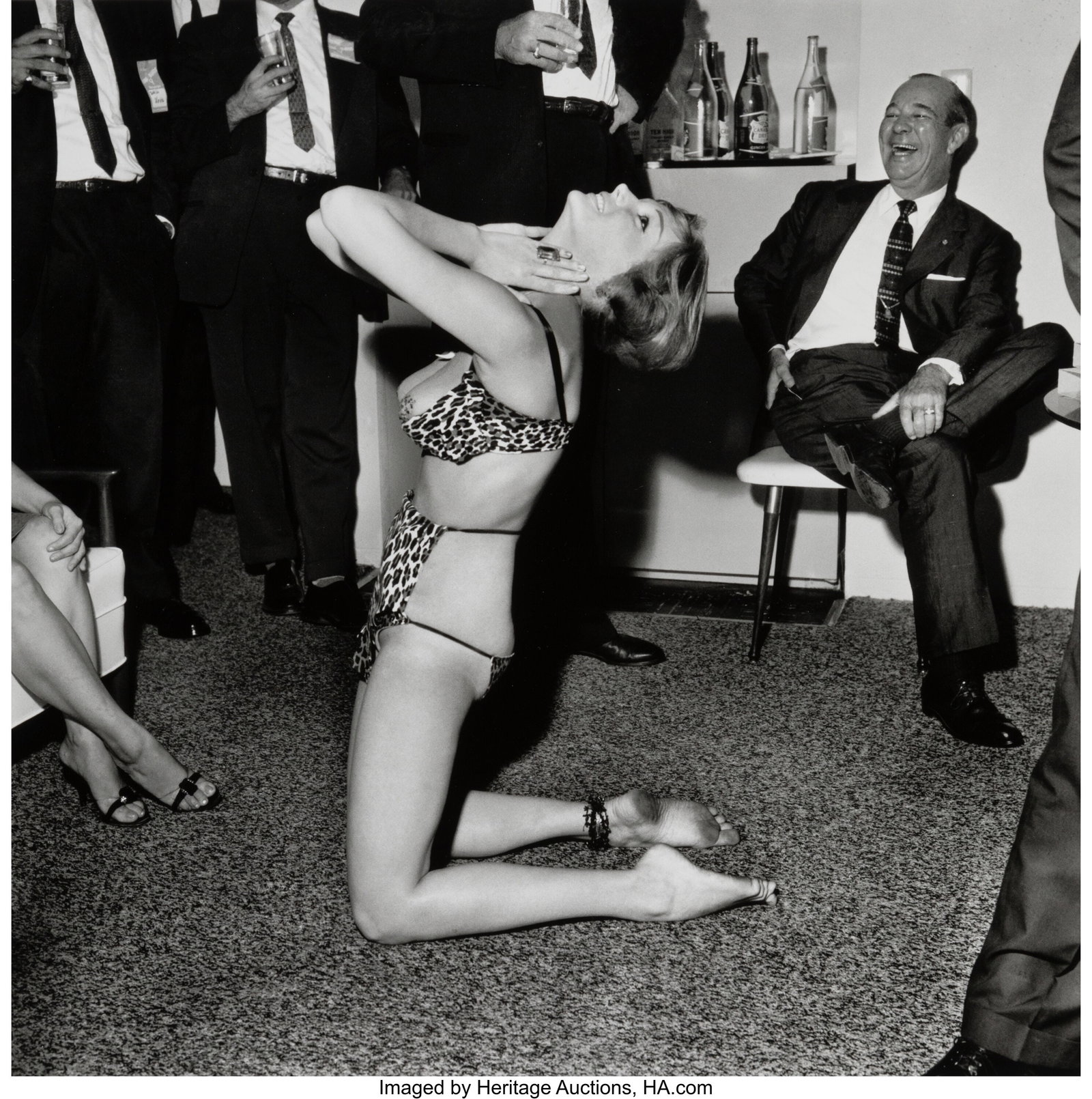 Bunny Yeager (American, 1929-2014) Striptease Da: Bunny Yeager (American, 1929-2014) Striptease Dancer at a Swinging Party, 1960s Gelatin silver print, printed later 10-1/4 x 10-1/4 inches (26.0 x 26&pe