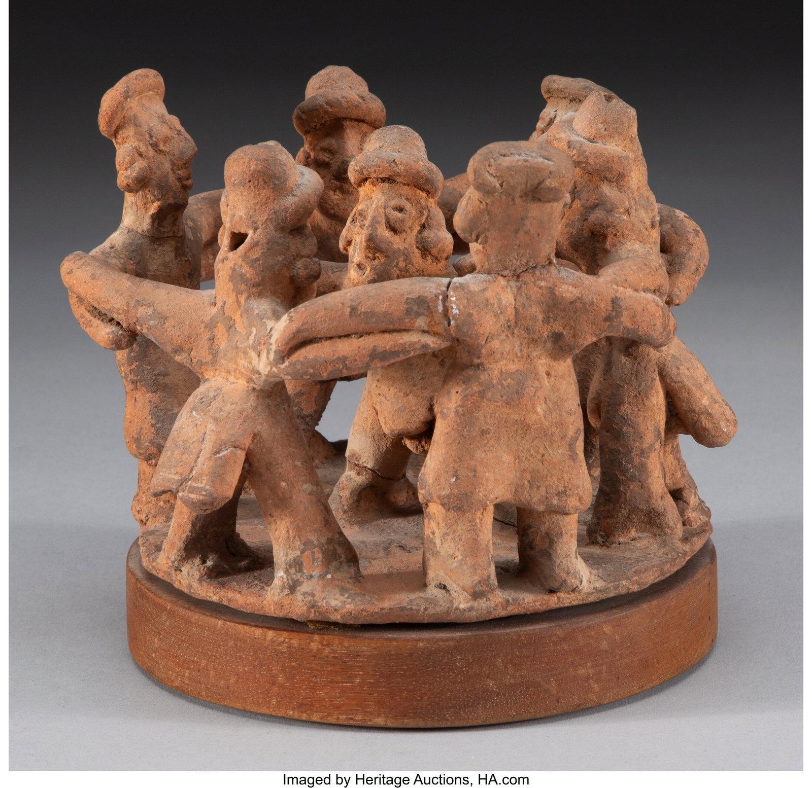 A Colima Circular Dance Scene West Mexico, c. : A Colima Circular Dance Scene West Mexico, c. 250 BC - 250 AD Six figures in a circle with arms linked around a central figure holding up rattles. All standing on a flat disc platf