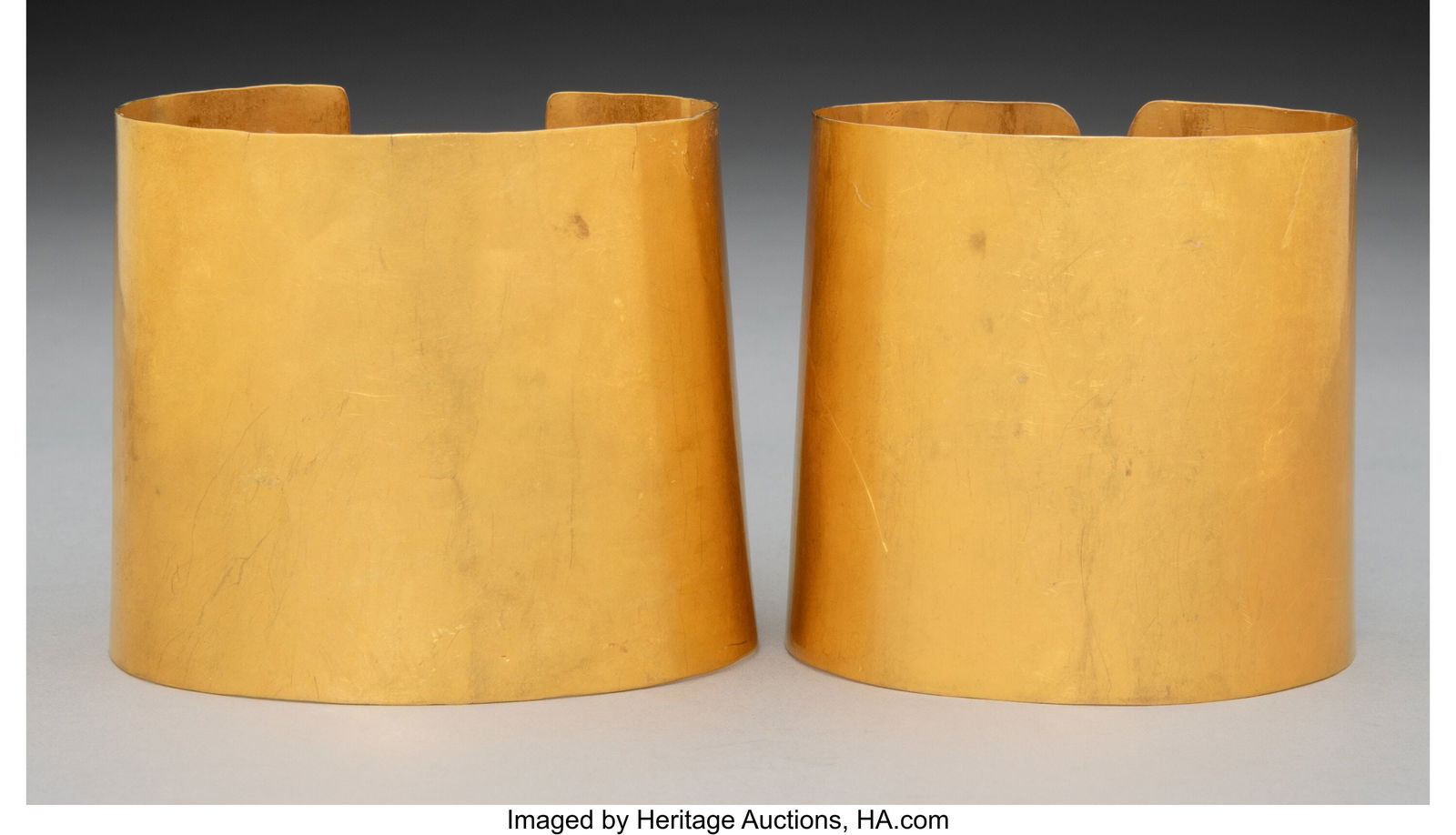 Two Large Pre-Columbian Gold Cuff Bracelets Pro: Two Large Pre-Columbian Gold Cuff Bracelets Probably from Central America/Colombia, c. 700-1000 AD Sheet gold alloy with a high gold content. Each with a highly reflective surf