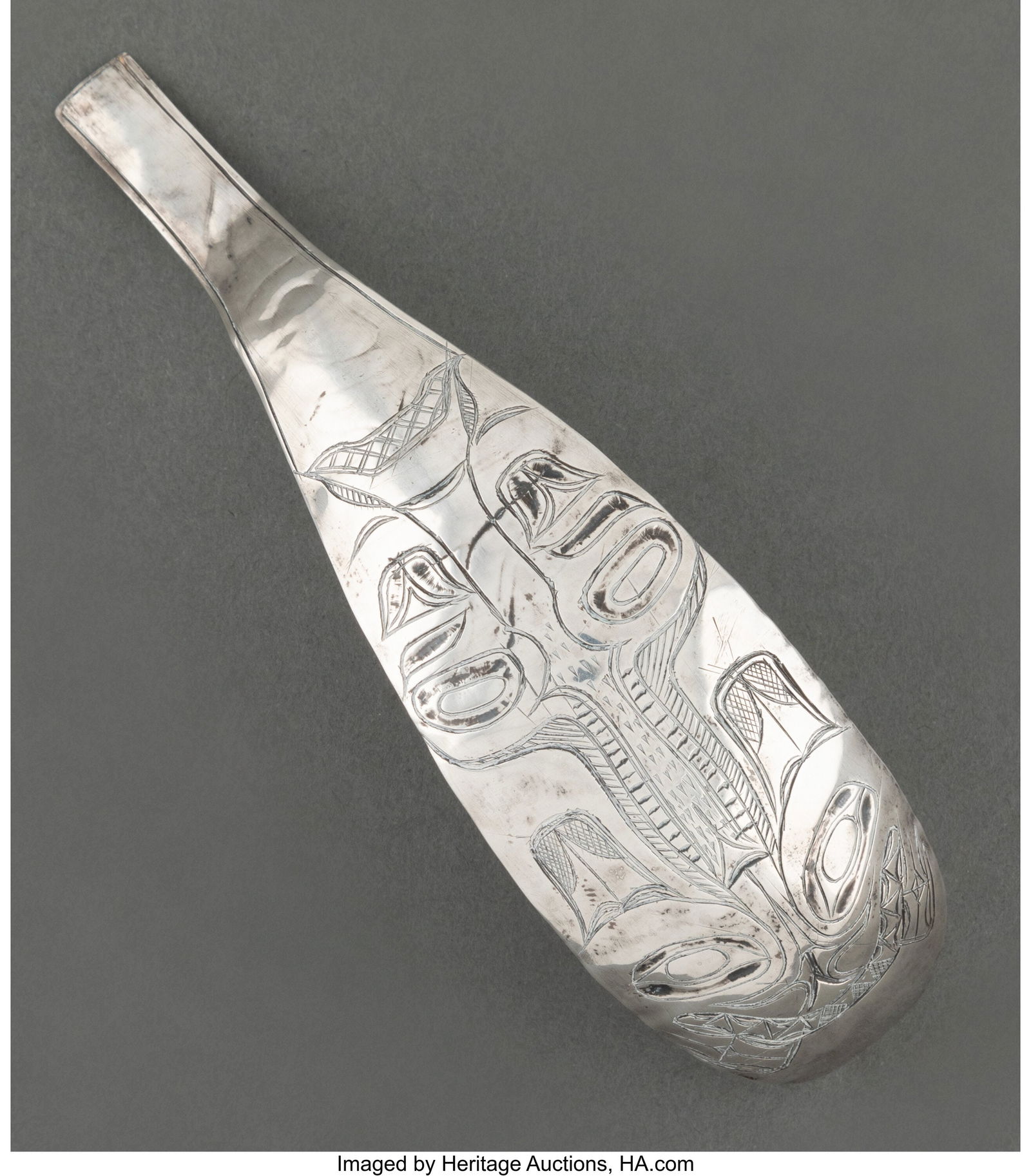 A Northwest Coast Ladle  c. 1930  etched silver (1 of 2)