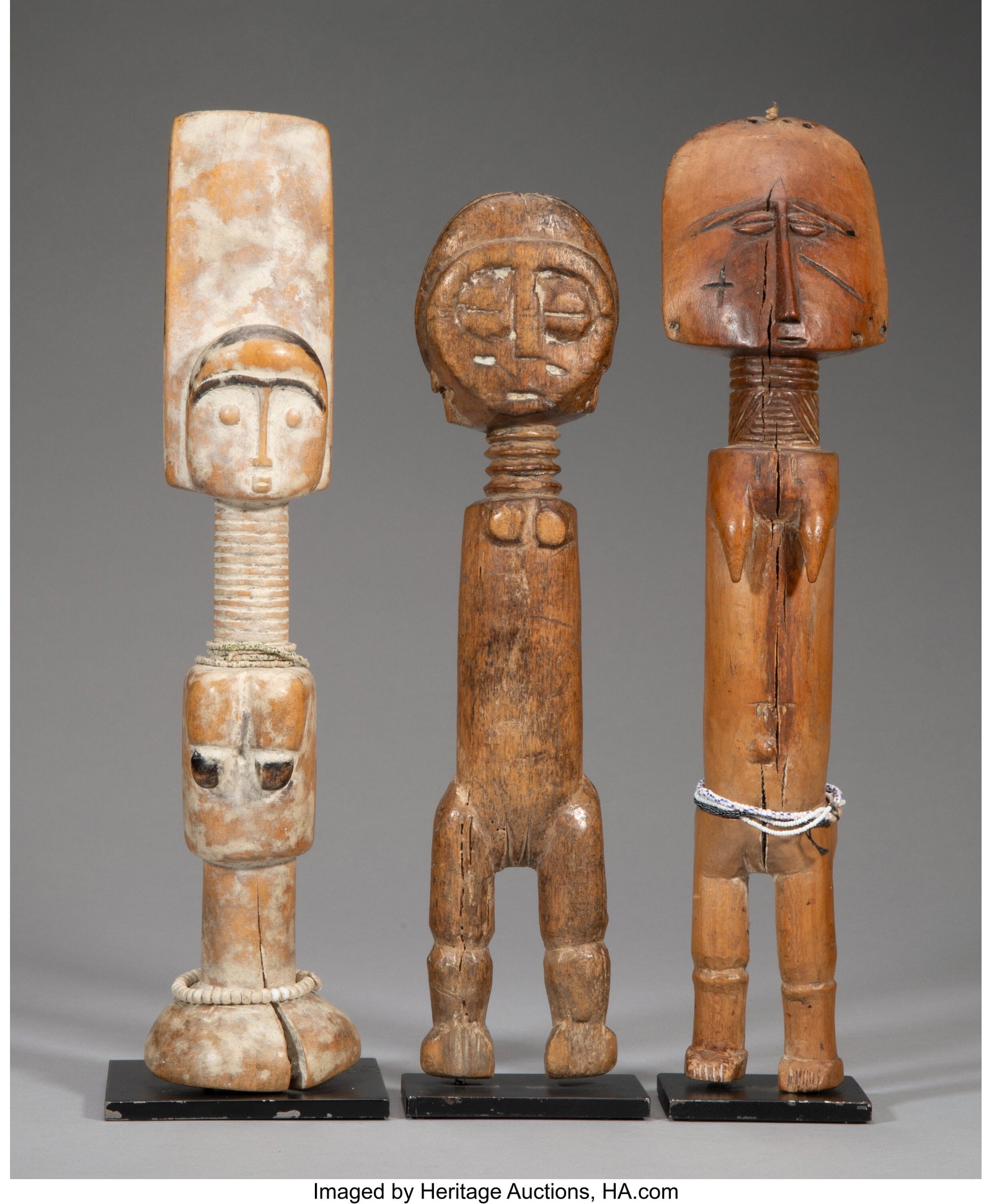 Three Akan Fertility Figures each with custom : Three Akan Fertility Figures each with custom metal stand Provenance: James Willis, San Francisco, CA Heights: ranging from 11 &frac12; to 13 inches HID03101062020 &co