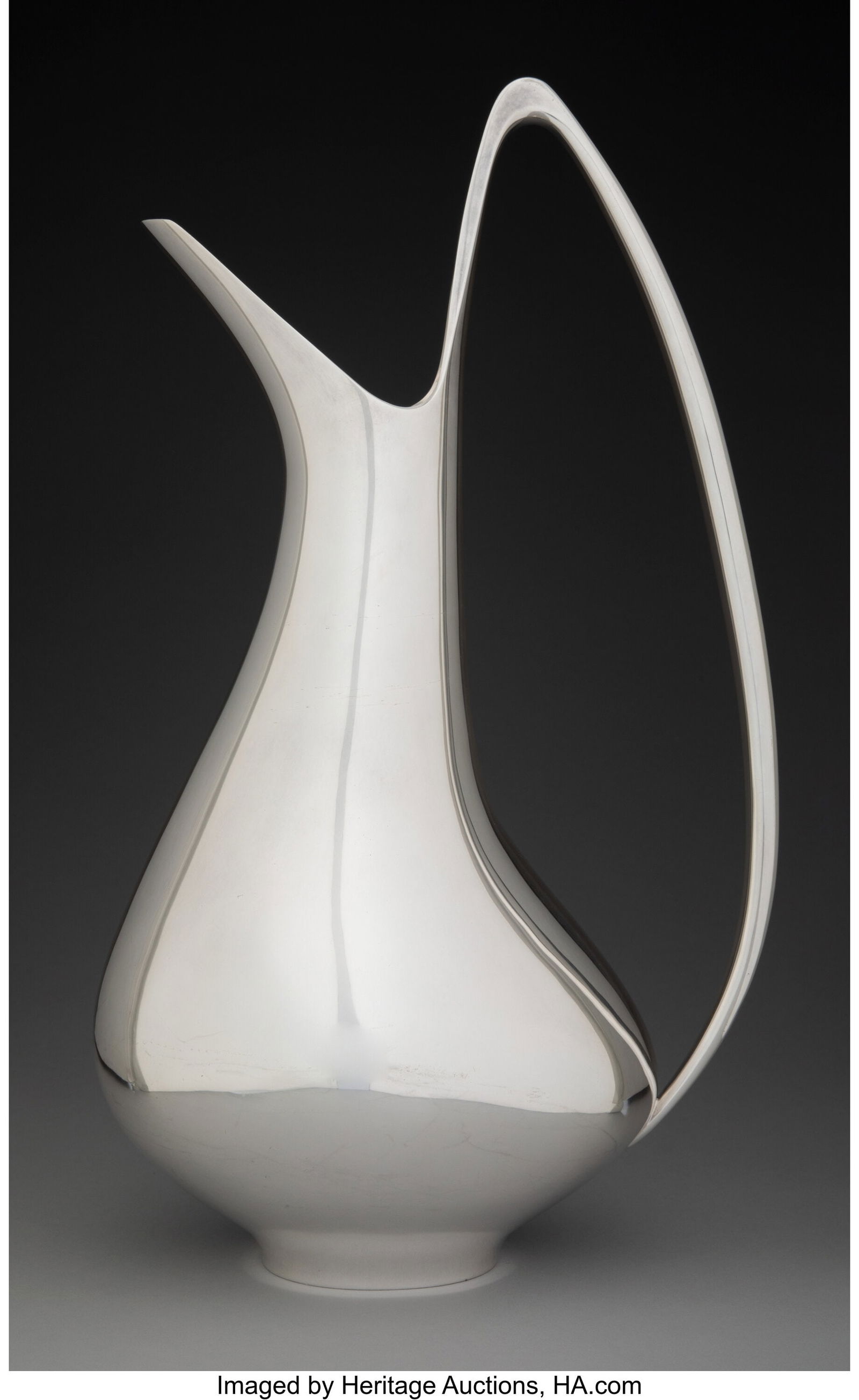 A Georg Jensen No. 1052 Swan Silver Water Pitche: A Georg Jensen No. 1052 Swan Silver Water Pitcher, Copenhagen, 1945-1977 Designed by Henning Koppel Marks: DESSIN, HK, DENMARK, (dotted oval-GEORG JENSE