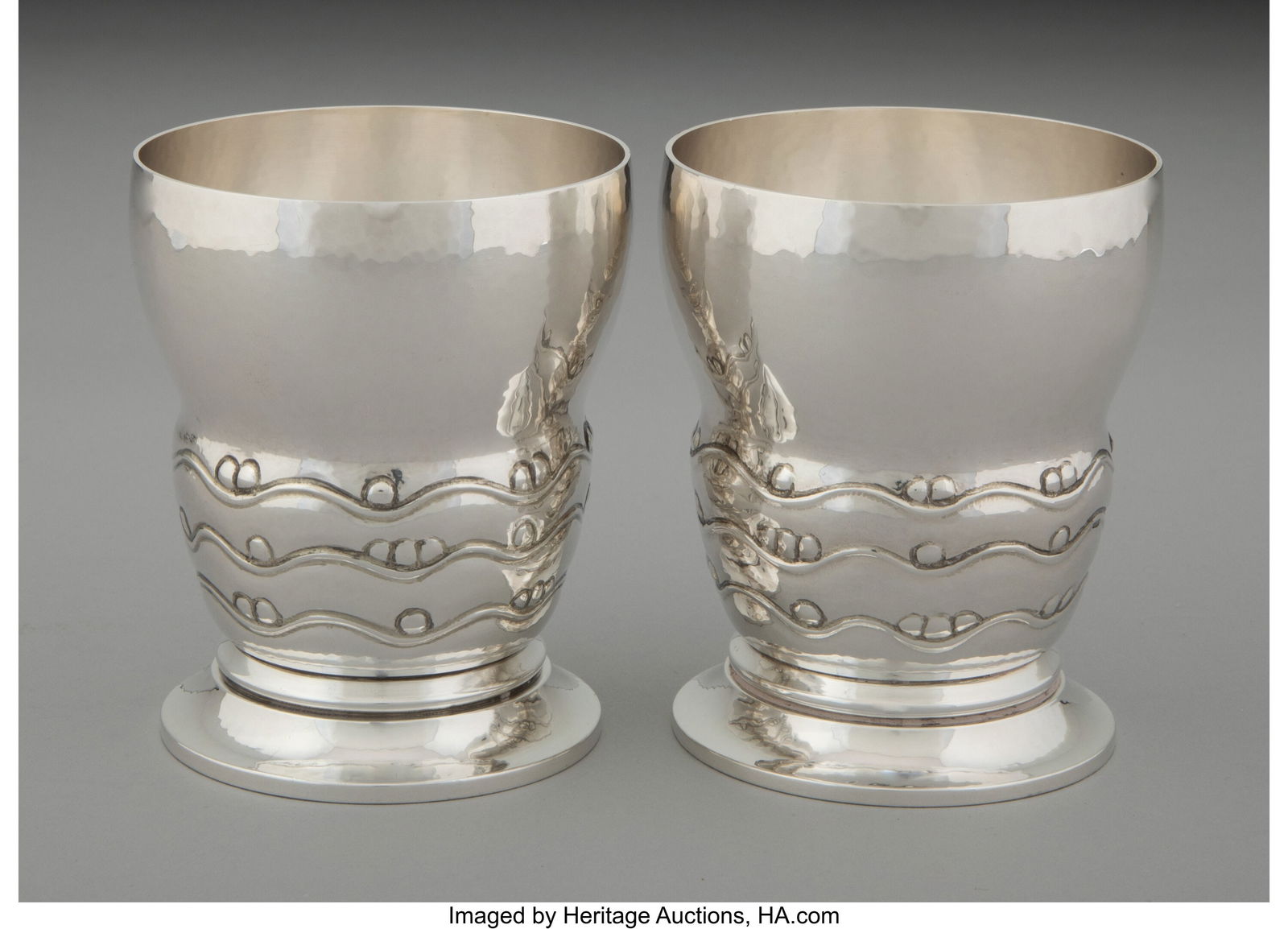 Two Georg Jensen No. 243A Silver Goblets, Copenh: Two Georg Jensen No. 243A Silver Goblets, Copenhagen, circa 1930 Designed by Georg Jensen Marks: N10, 925S, DENMARK, (dotted oval-GEORG JENSEN)&com