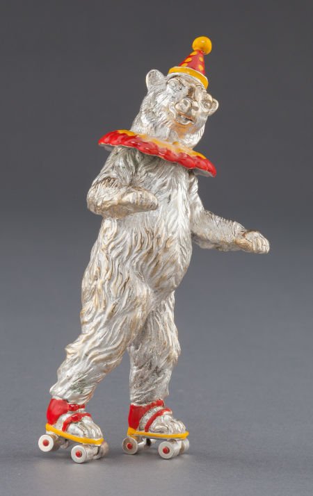 A TIFFANY & CO. SILVER AND ENAMEL CIRCUS BEAR ON: A TIFFANY & CO. SILVER AND ENAMEL CIRCUS BEAR ON ROLLER SKATES DESIGNED BY GENE MOORE 