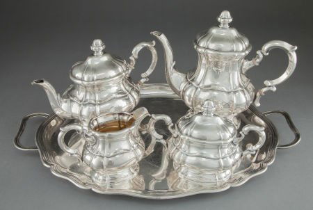A FIVE PIECE GERMAN SILVER AND SILVER GILT TEA A: A FIVE PIECE GERMAN SILVER AND SILVER GILT TEA AND COFFEE SERVICE WITH TRAY Maker unk