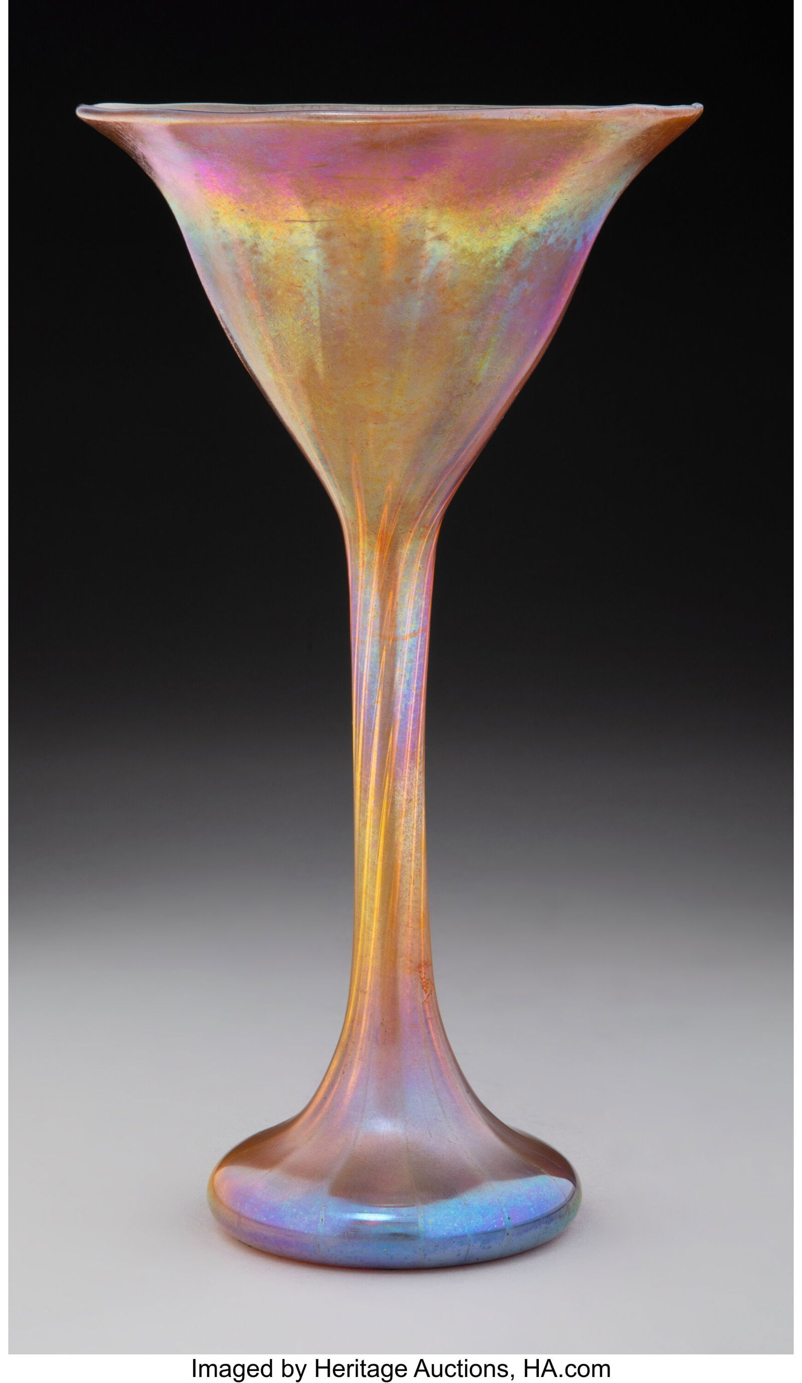 Tiffany Studios Floriform Vase, circa 1910 USA F: Tiffany Studios Floriform Vase, circa 1910 USA Favrile glass 9-3/8 x 5-1/8 inches (23.7 x 13.0 cm) Marks: (effaced) L.C.T, W55