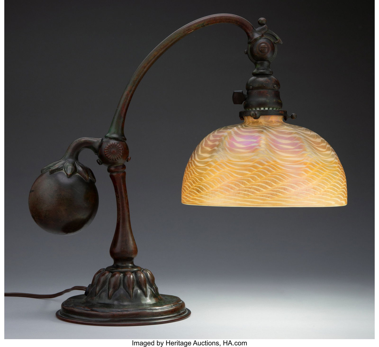 Tiffany Studios Counterbalance Desk Lamp with D: Tiffany Studios Counterbalance Desk Lamp with Damascene shade, circa 1910 USA Favrile glass, patinated bronze 16 inches (40.6 cm) (overall) Marks to shade: L.C.T. Favrile Marks to base: 415, TIFFANY &