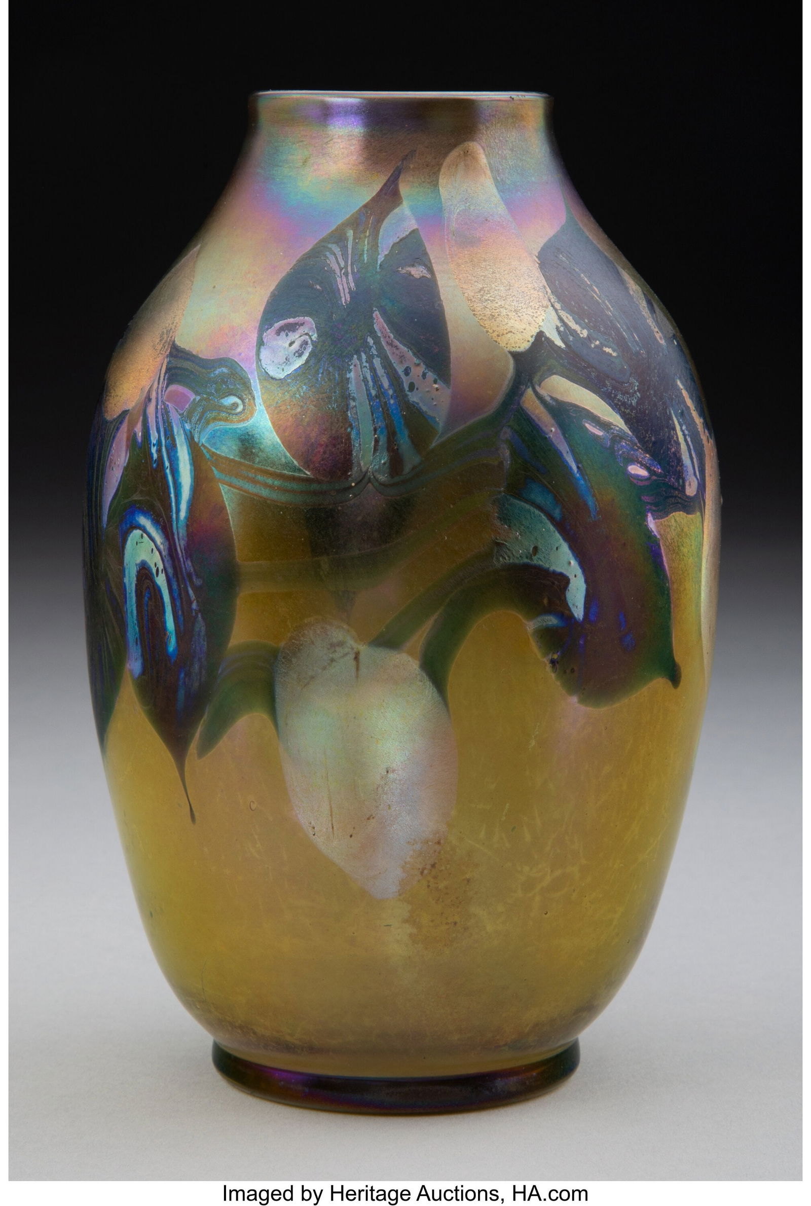 Tiffany Studios Leaf and Vine Vase, circa 1910: Tiffany Studios Leaf and Vine Vase, circa 1910 USA Decorated Favrile glass 6 inches (15.2 cm) Marks: L.C.T. Q9827 HID03101062020 © 2024 Heritage