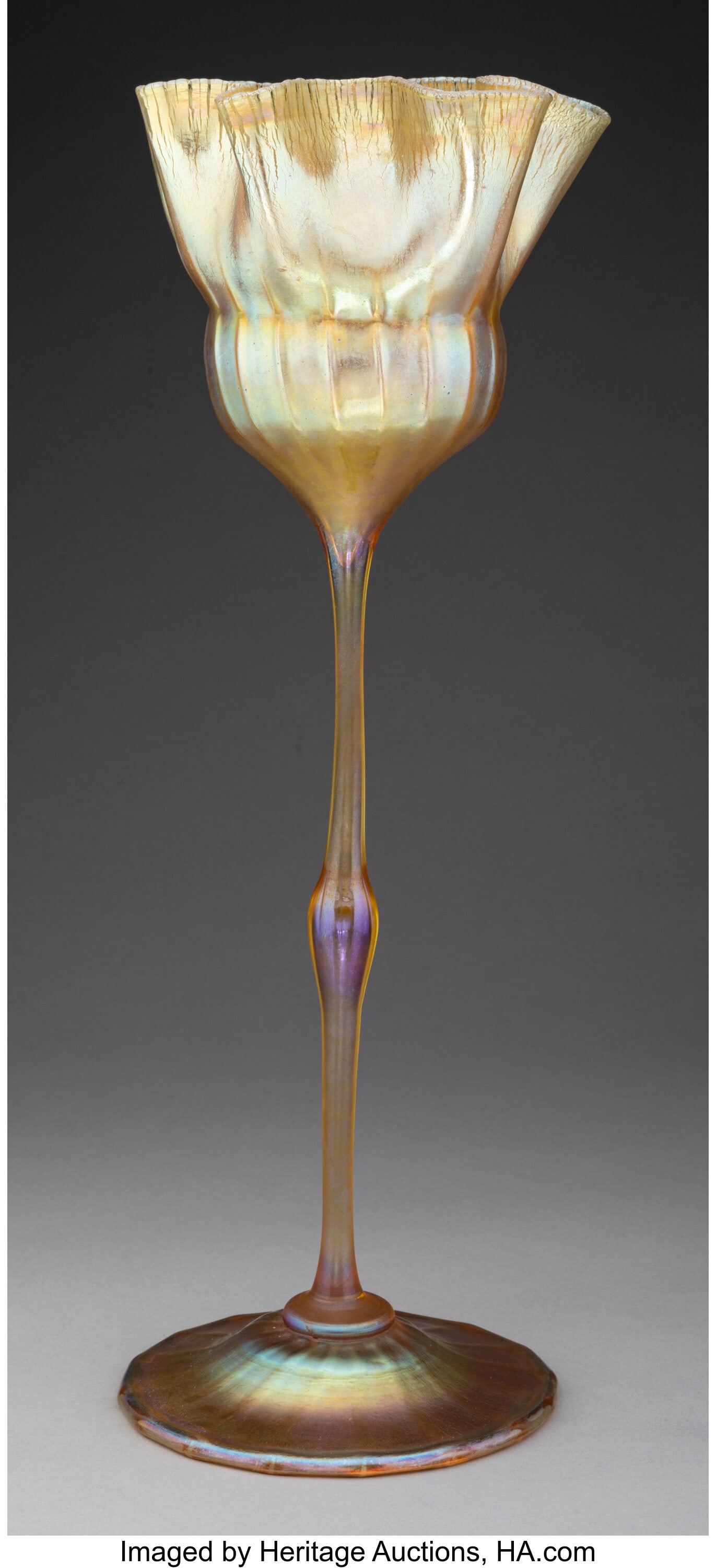 Tiffany Studios Tall Floriform Vase, circa 1910: Tiffany Studios Tall Floriform Vase, circa 1910 USA Favrile glass 15-3/4 inches (40.0 cm) Marks: L.C.T. Y3549 Property from A.C. Mor