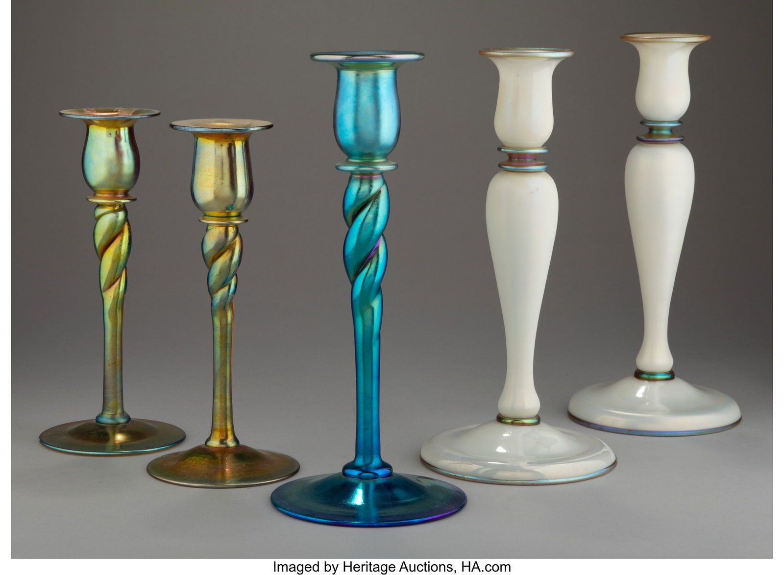 Steuben Glass Works Five Candlesticks, circa 191: Steuben Glass Works Five Candlesticks, circa 1910 USA Aurene glass 10 x 4-1/4 inches (25.4 x 10.8 cm) (tallest) Marks to two: aurene, 686 The gr