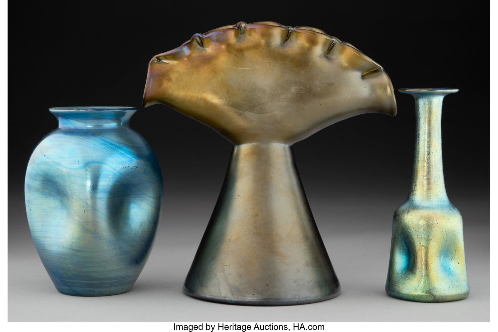 Loetz Three Vases, circa 1900 Iridescent glass: Loetz Three Vases, circa 1900 Iridescent glass 8 inches (20.3 cm) (tallest, Glatt Bonze vase) The lot comprising: 1 Capri vase, 1898; 1 Glat bro