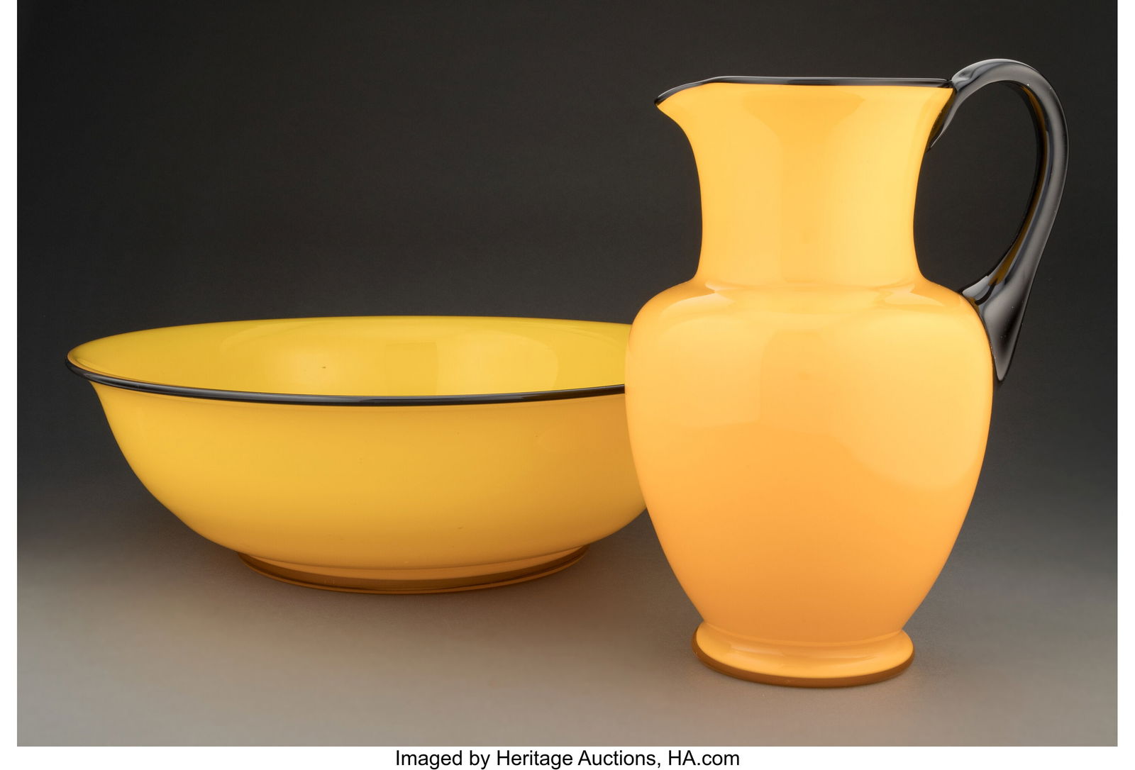 Loetz Pitcher and Bowl, circa 1930 Bohemia Tang: Loetz Pitcher and Bowl, circa 1930 Bohemia Tango glass 8-7/8 inches (22.5 cm) (tallest) HID03101062020 © 2024 Heritage Auctions | All Rights Reserved