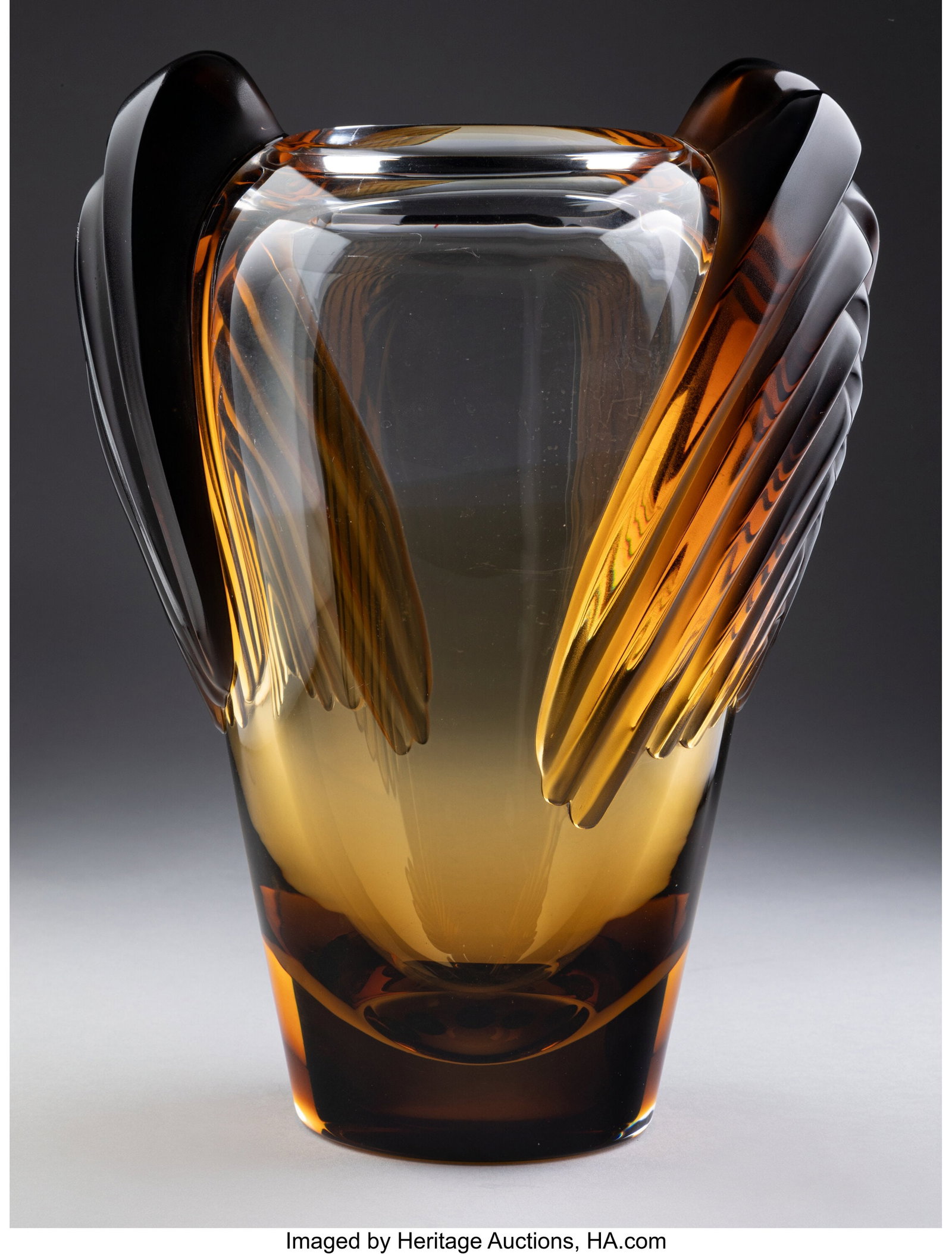 Lalique Marrakech Vase, post-1945 France Clear a: Lalique Marrakech Vase, post-1945 France Clear and amber glass 12-1/2 inches (31.8 cm) Marks: Lalique France HID03101062020 © 2024 Heritage Auctions | All Ri