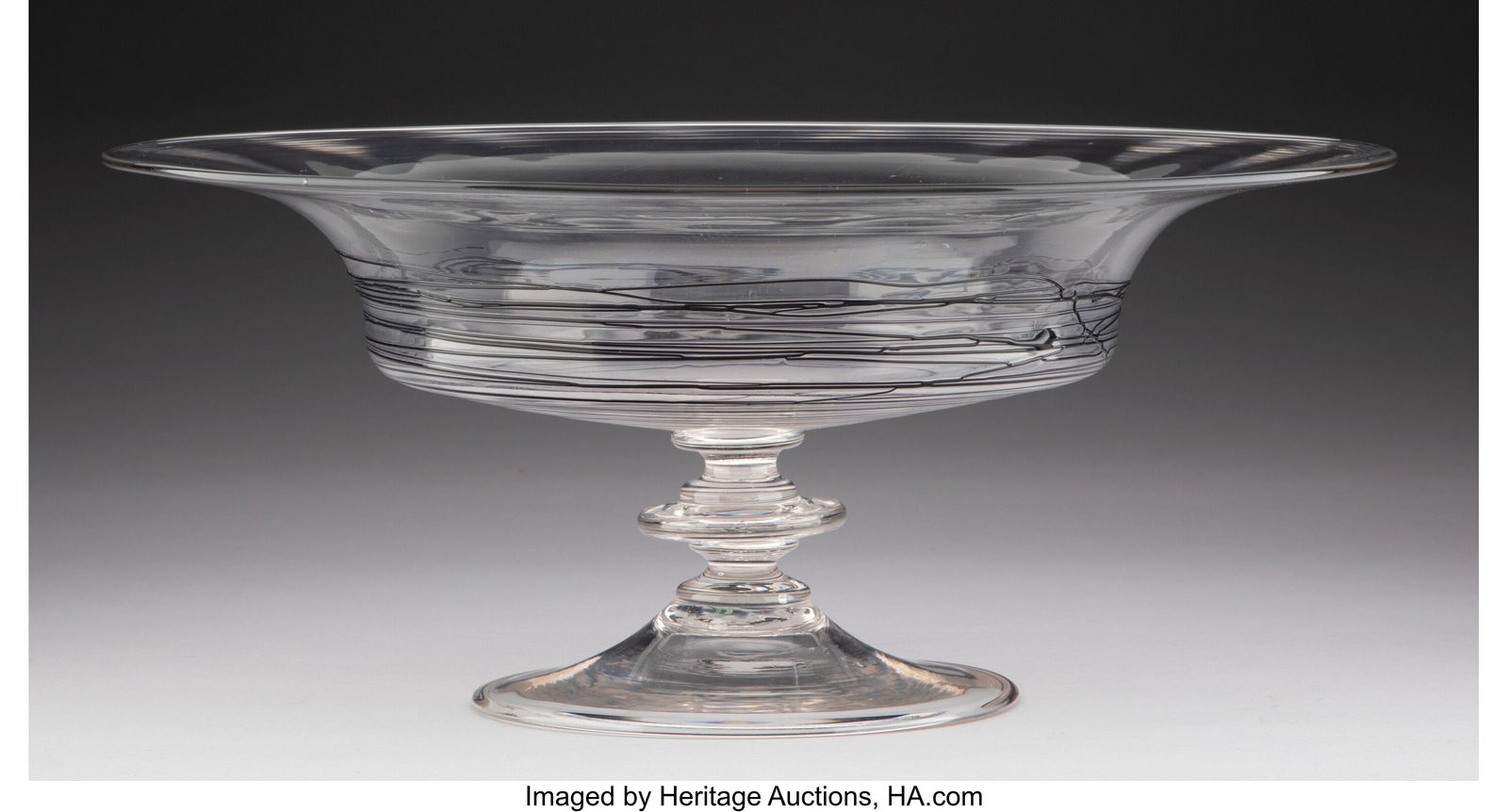 A Steuben Glass Threaded Footed Bowl Marks: STEU: A Steuben Glass Threaded Footed Bowl Marks: STEUBEN 6 x 13-3/4 inches (15.2 x 34.9 cm) HID03101062020 © 2024 Heritage Auctions | All Rights Reserved www&per