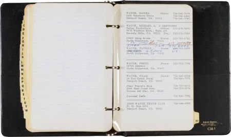 A John Wayne Address Book, Circa 1976.: A John Wayne Address Book, Circa 1976. A black vinyl three-ring binder, A to Z tabs, insi