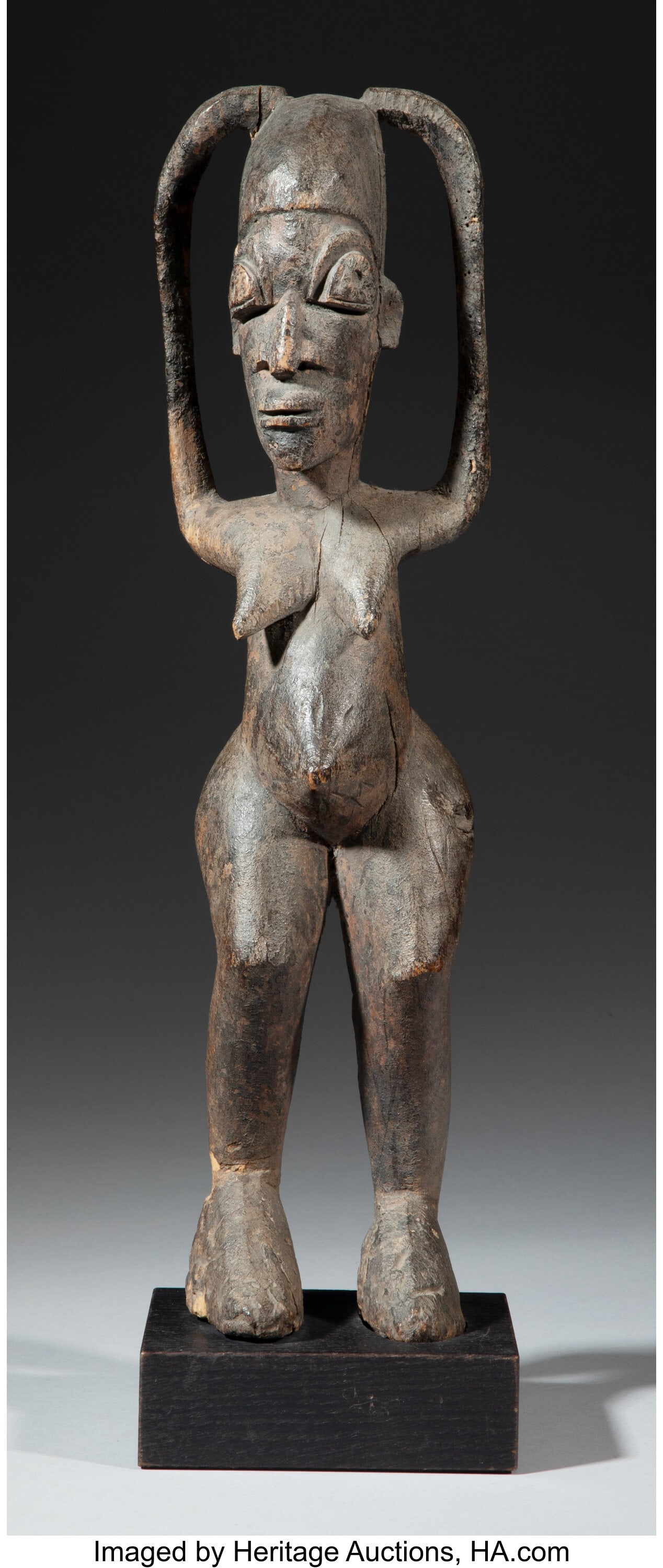 A Lobi Female Figure Burkina Faso, c. early 2: A Lobi Female Figure Burkina Faso, c. early 20th century Attributed to the workshop of Sikire Kambire (1896-1963). Hardwood with an encrusted dark brown/black patina&