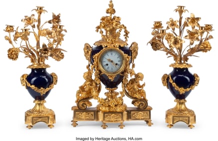 61163&colon; A French Three-Piece Gilt Bronze-Mounted Blue Sèvres-Style Porcelain Clock Garniture