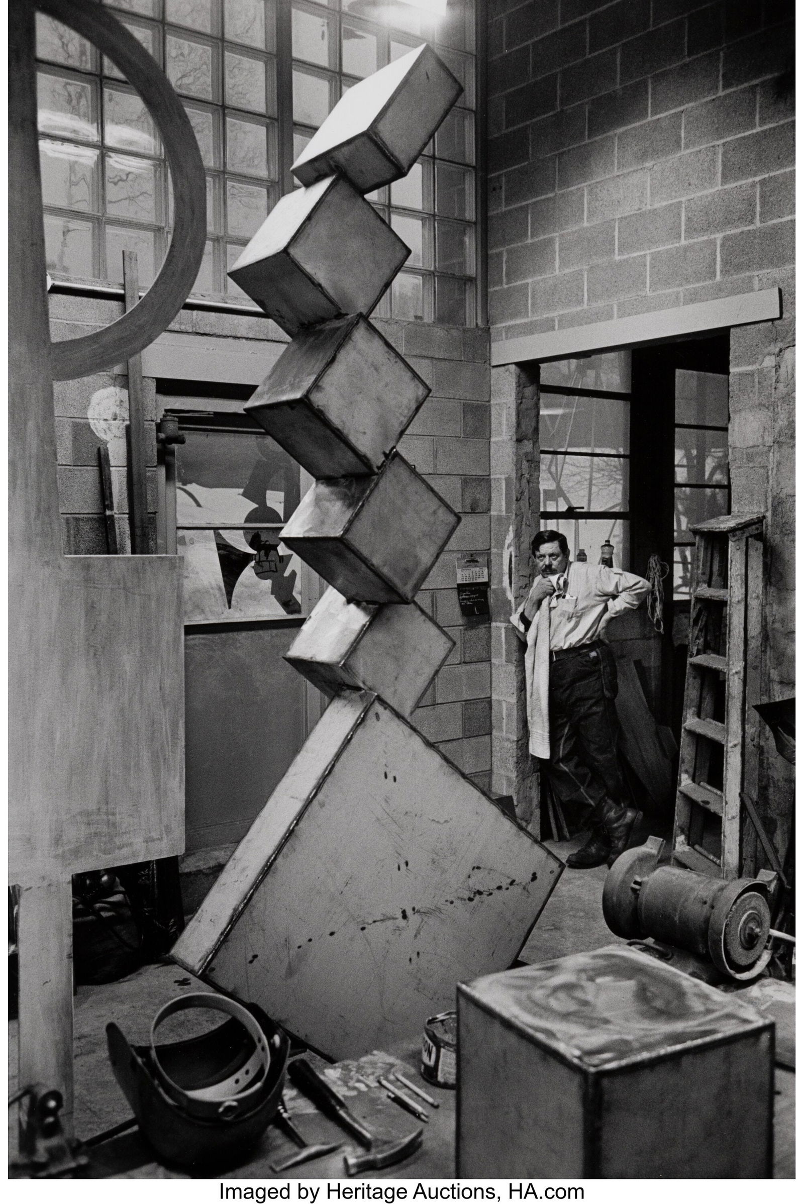 Dan Budnik (American, b. 1933) David Smith with: Dan Budnik (American, b. 1933) David Smith with "Cubi I", Bolton Landing, New York, March 1963 Gelatin silver print, printed later 16-1/8 x 10-7/