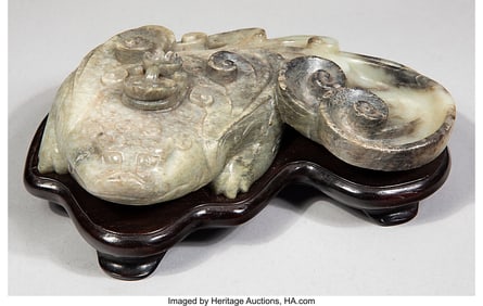 78007&colon; A Chinese Mottled White Jade Washer in the Form 