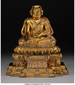 78114&colon; A Tibetan Gilt Bronze Figure of a Lama&comma; 15th cen