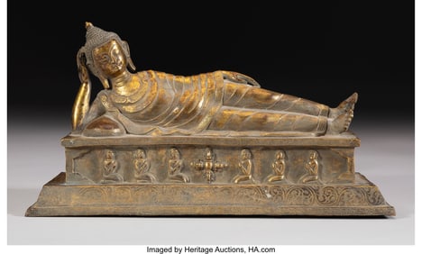 78251&colon; A Himalayan Gilt Bronze Figure of a Reclining Bu
