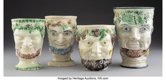 61256: A Group of Four Staffordshire Earthenware Bacchu