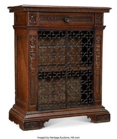 61056: An Italian Carved Walnut Grill-Front Cabinet, 18