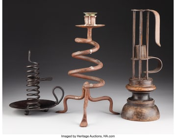 61073: A Group of Three Metal Cellar Candlesticks 10-3/