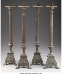 61082: A Set of Four Continental Cast Iron Candlesticks