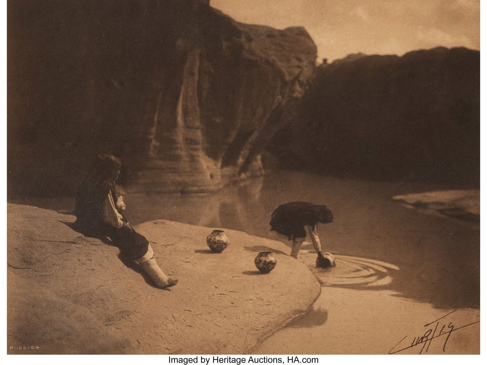 Edward Sheriff Curtis (American, 1868-1952) At t: Edward Sheriff Curtis (American, 1868-1952) At the Old Well of Acoma, 1904 Platinum print 5-3/4 x 7-5/8 inches (14.6 x 19.4 cm) (image/sh