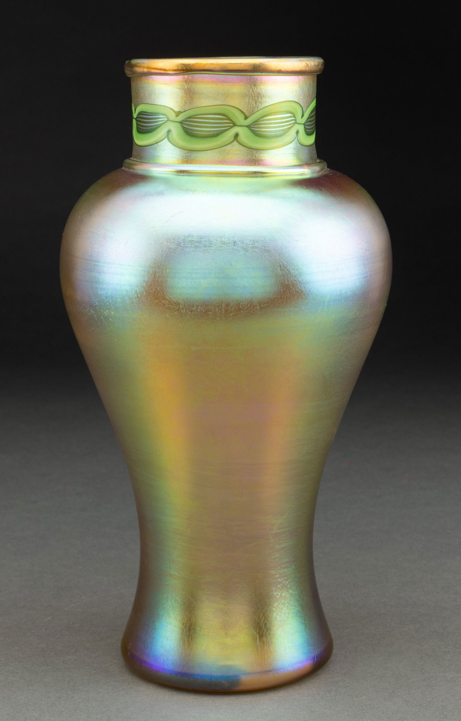 Tiffany Studios Tel-El-Amarna Vase, circa 1910 F: Tiffany Studios Tel-El-Amarna Vase, circa 1910 Favrile glass 9 inches (22.9 cm) Marks: 3422E, L.C.Tiffany- Favrile HID03101062020 © 2024 Heritage