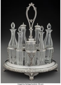 74059&colon; A Victorian Seven Bottle Silver and Cut-Glass Cr