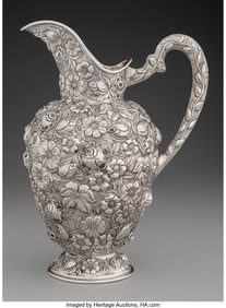 74413: An American Chased Repousse Silver Floral Pitche