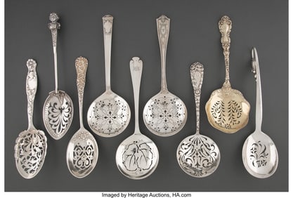 74357: A Collection of Nine Silver Pierced Serving Spoo