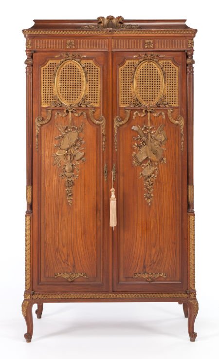 A FRENCH CANED, PARTIAL GILT MAHOGANY ARMOIRE C: A FRENCH CANED, PARTIAL GILT MAHOGANY ARMOIRE Circa 193065 x 35-1/2 x 17 inches (